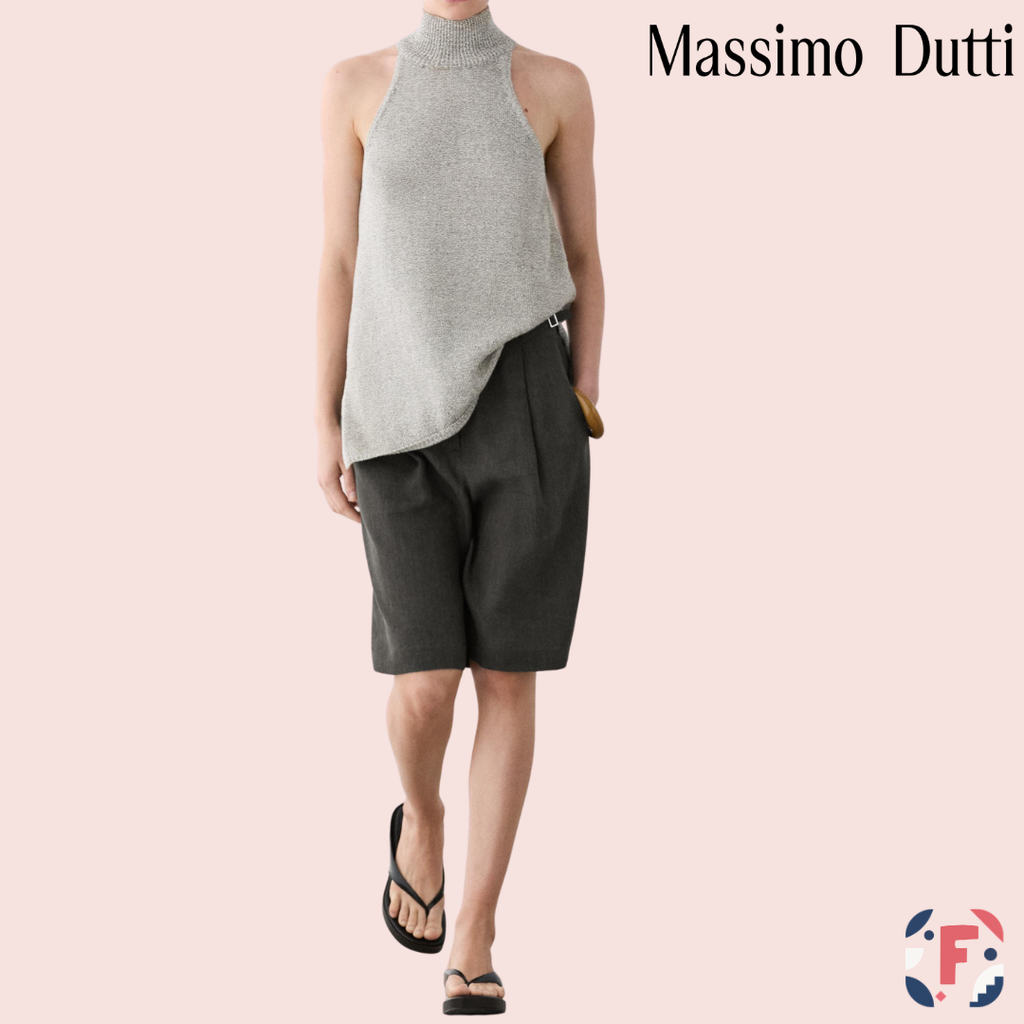 Modelo con top gris de punto y cuello halter